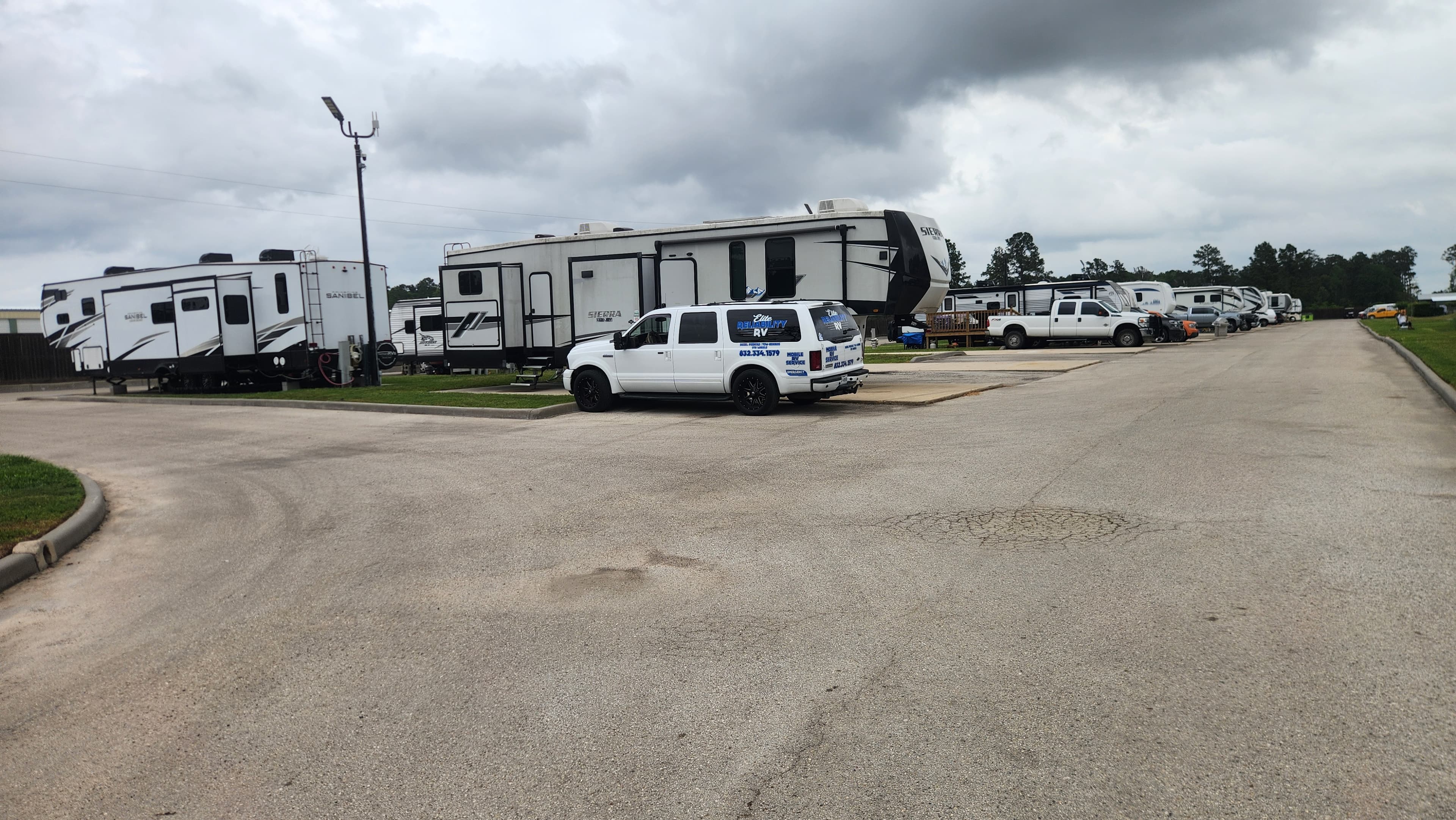 Elite Reliability RV service truck at an RV park in Montgomery County TX